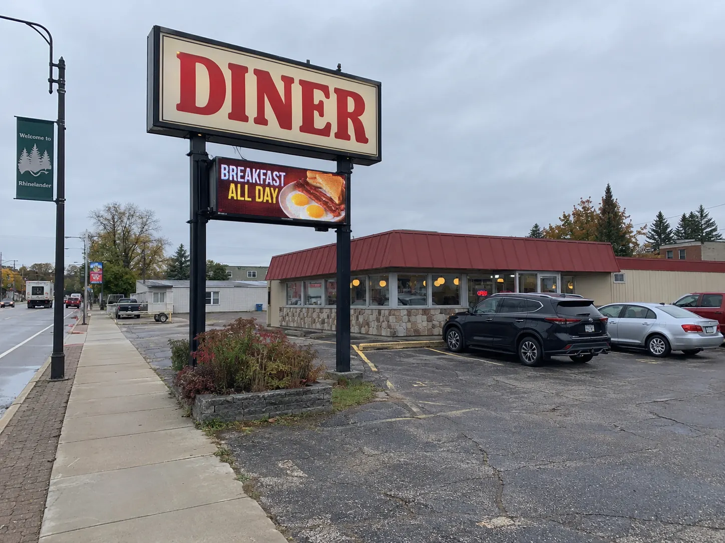 Roadside LED message center below a diner identification sign